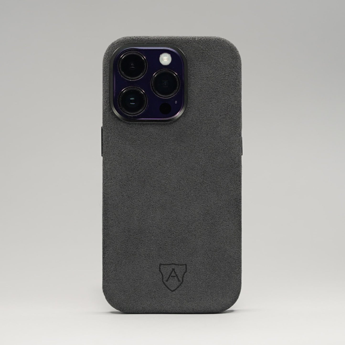A premium black Alcantara iPhone case with a camera cutout and metal buttons, featuring a sleek and luxurious design.