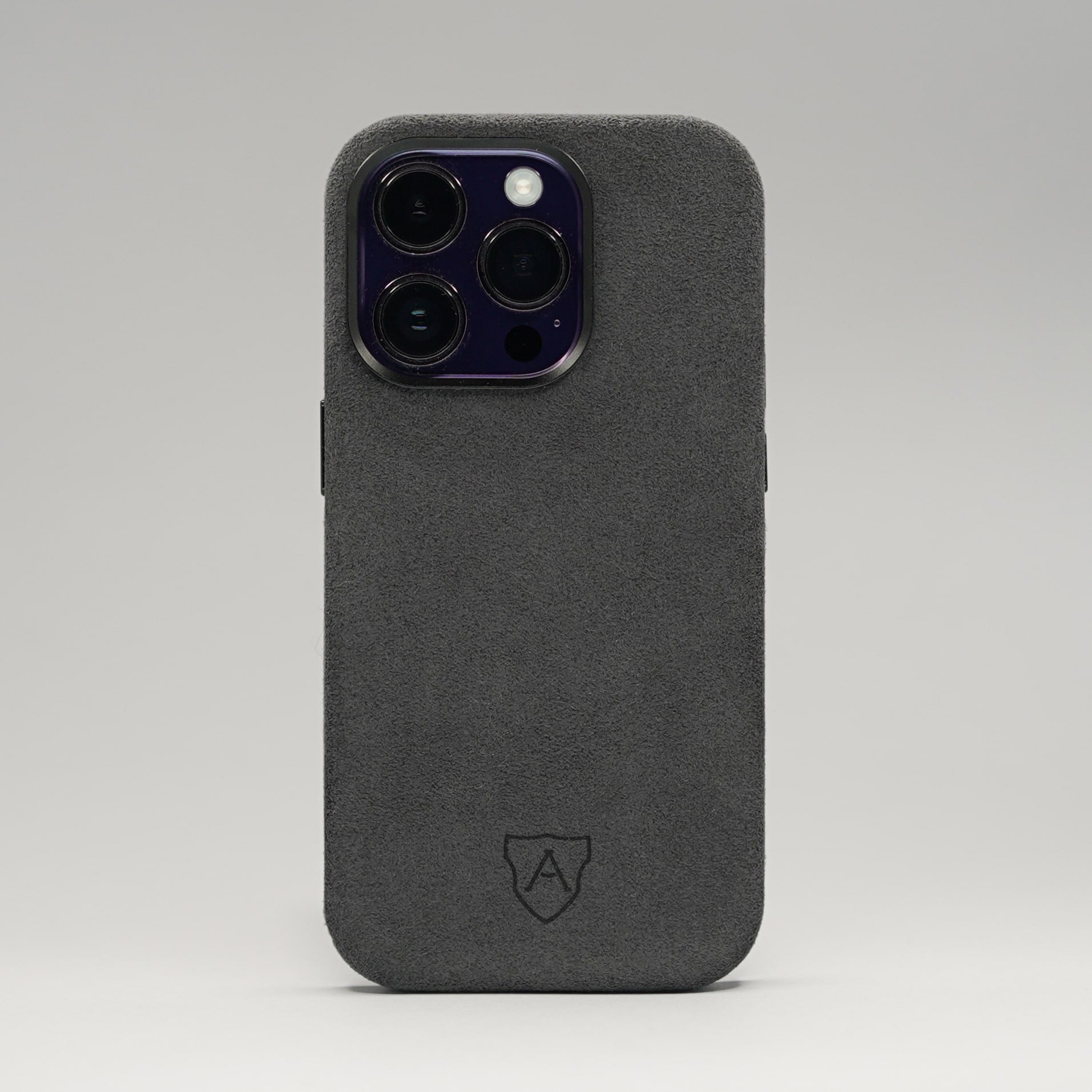 A premium black Alcantara iPhone case with a camera cutout and metal buttons, featuring a sleek and luxurious design.