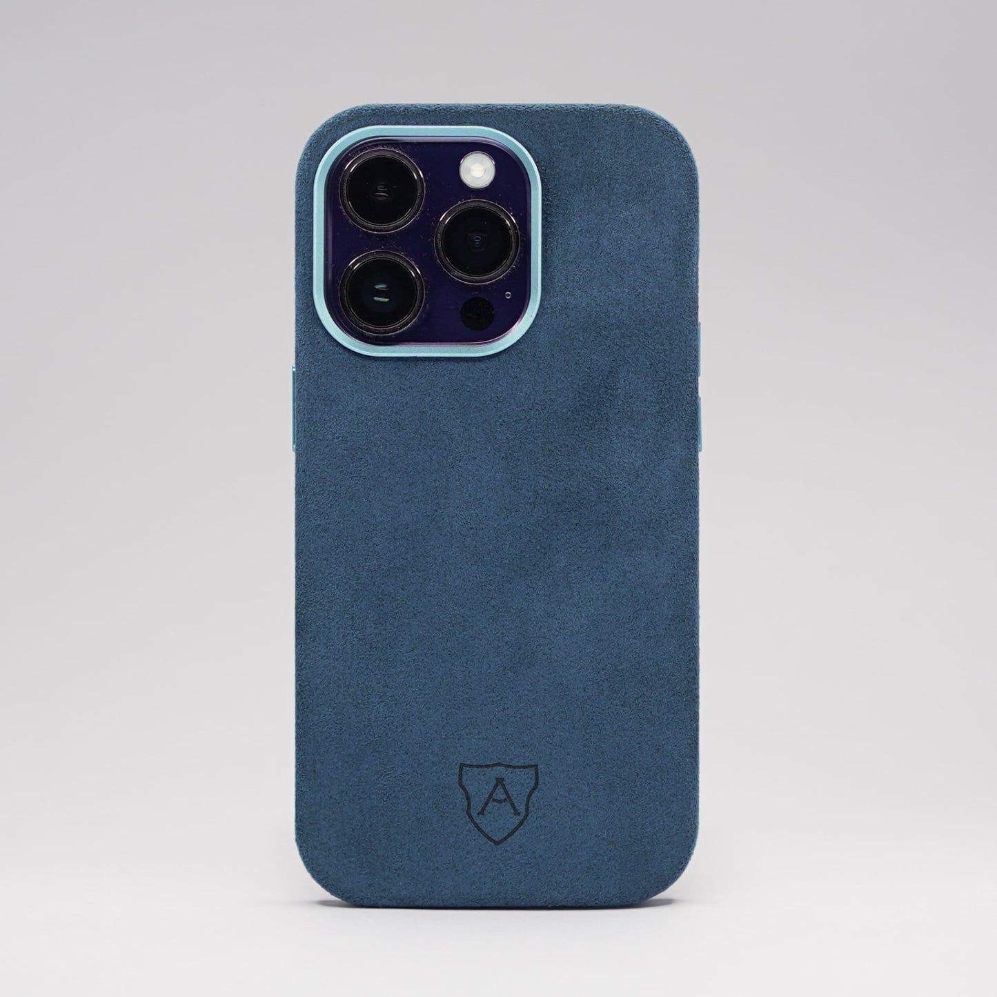 A premium blue Alcantara iPhone case with a camera cutout and metal buttons, featuring a sleek and luxurious design.