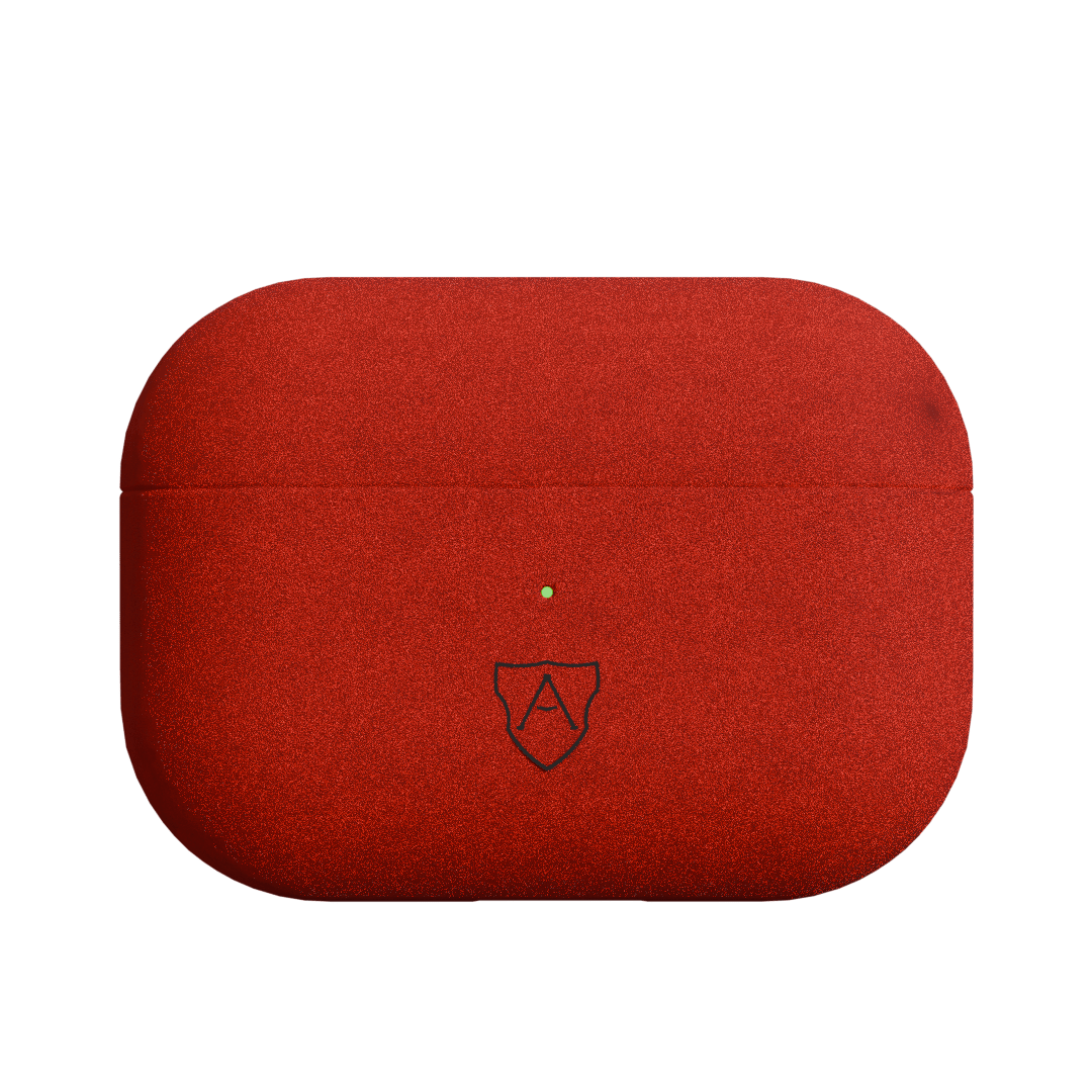 A red case for AirPods Pro 2 made of Italian Alcantara with a visible brand logo on the front.