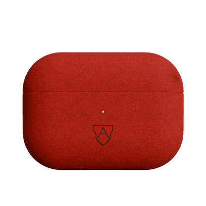 A red case for AirPods Pro 2 made of Italian Alcantara with a visible brand logo on the front.